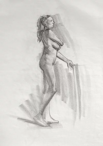 Figure drawing of a woman in charcoal
