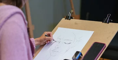 student drawing a portrait