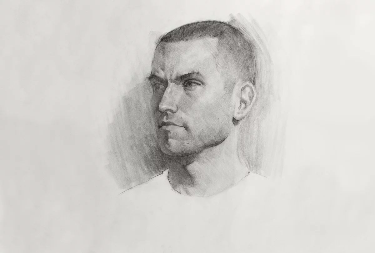 Charcoal drawing of a man with short hair