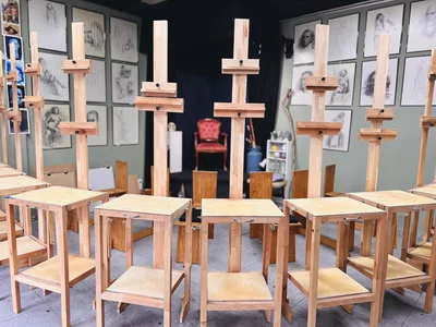 easels in an atelier setup for a life painting session